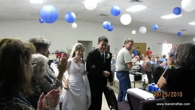 Aaron and Diane Traffas entering the reception