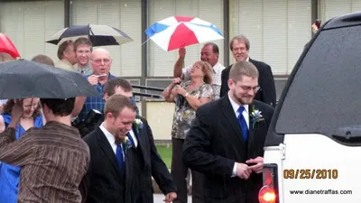 Groomsmen and Bridesmaids enter the limousine