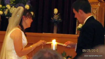 Aaron and Diane Traffas lighting the unity candle